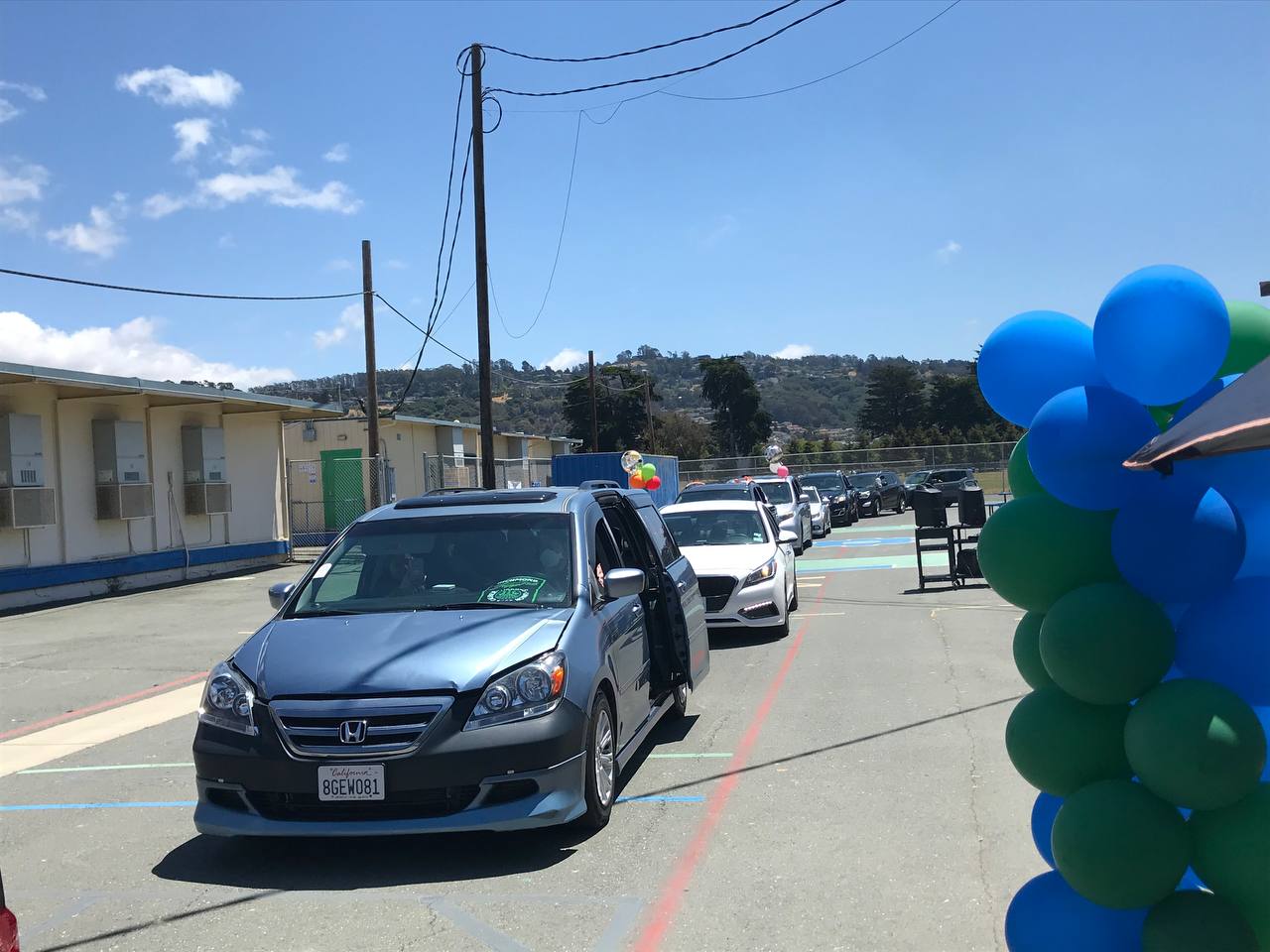 Line of cars demonstrating solidarity with the Caliber Workers Union.